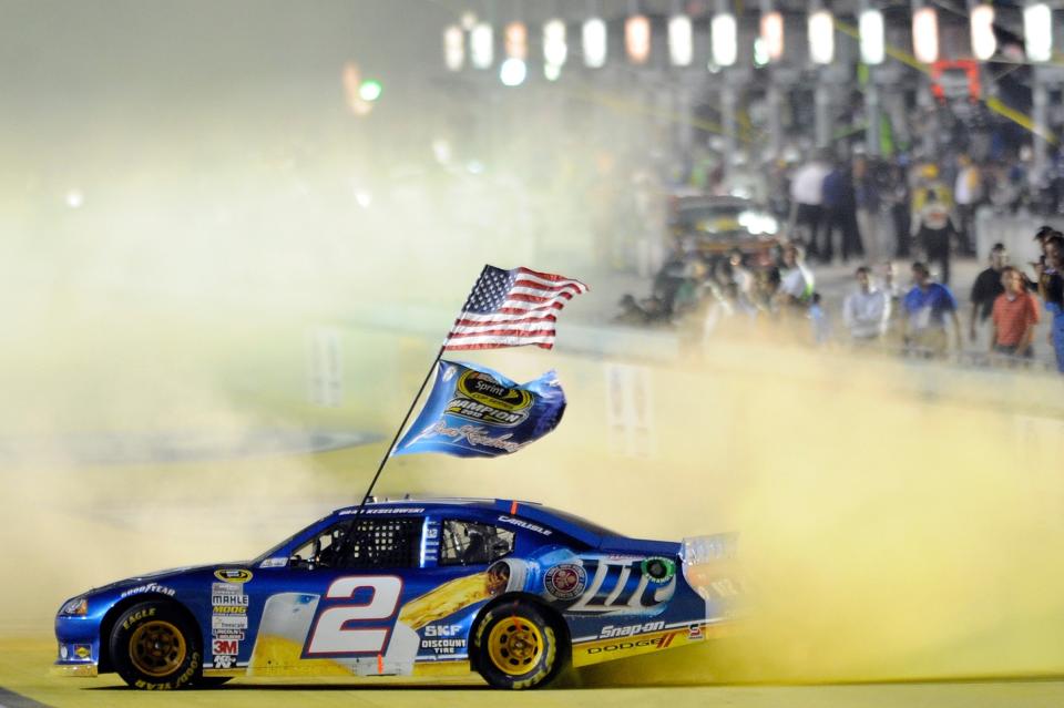 Brad Keselowski, driver of the #2 Miller Lite Dodge, celebrates with a burnout after winning the series championship and finishing in fifteenth place for the NASCAR Sprint Cup Series Ford EcoBoost 400 at Homestead-Miami Speedway on November 18, 2012 in Homestead, Florida. (Photo by John Harrelson/Getty Images for NASCAR)