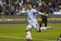 Cristiano Ronaldo scores his side's second goal playing for a combined XI of Saudi Arabian teams Al Nassr and PSG during a friendly soccer match, at the King Saud University Stadium, in Riyadh, Saudi Arabia, Thursday, Jan. 19, 2023. (AP Photo/Hussein Malla)
