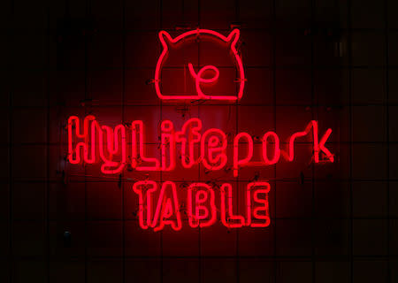 The logo of HyLife Pork Table, a pork dish restaurant operated by Canadian pig farmer and pork processor HyLife, is displayed inside the restaurant at Daikanyama district in Tokyo, Japan October 31, 2016. REUTERS/Issei Kato