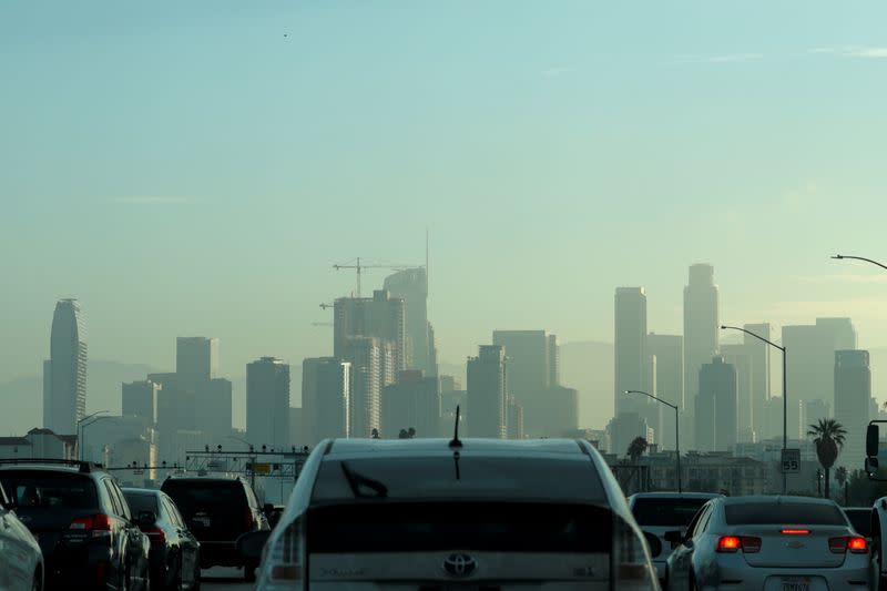 FILE PHOTO: Commuters navigate early morning traffic as they drive towards downtown in Los Angeles, California