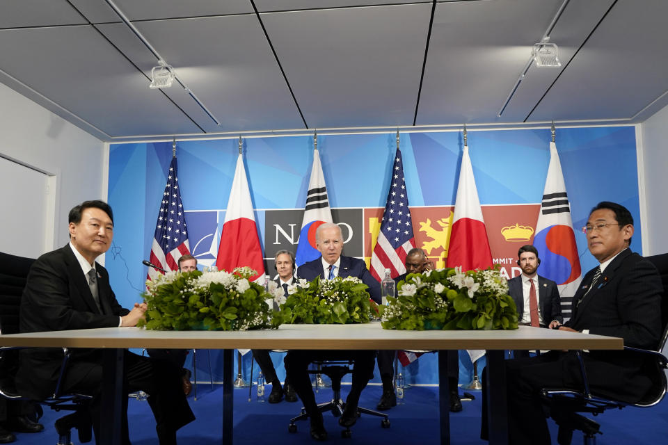 FILE - President Joe Biden, center, meets with South Korea's President Yoon Suk Yeol, left, and Japan's Prime Minister Fumio Kishida, right, during the NATO summit in Madrid on June 29, 2022. South Korea’s president wants Japan to join his efforts to improve ties frayed over Tokyo’s past colonial rule, saying there is an increasing need for greater bilateral cooperation because of North Korean nuclear threats and global supply chain challenges. (AP Photo/Susan Walsh, File)