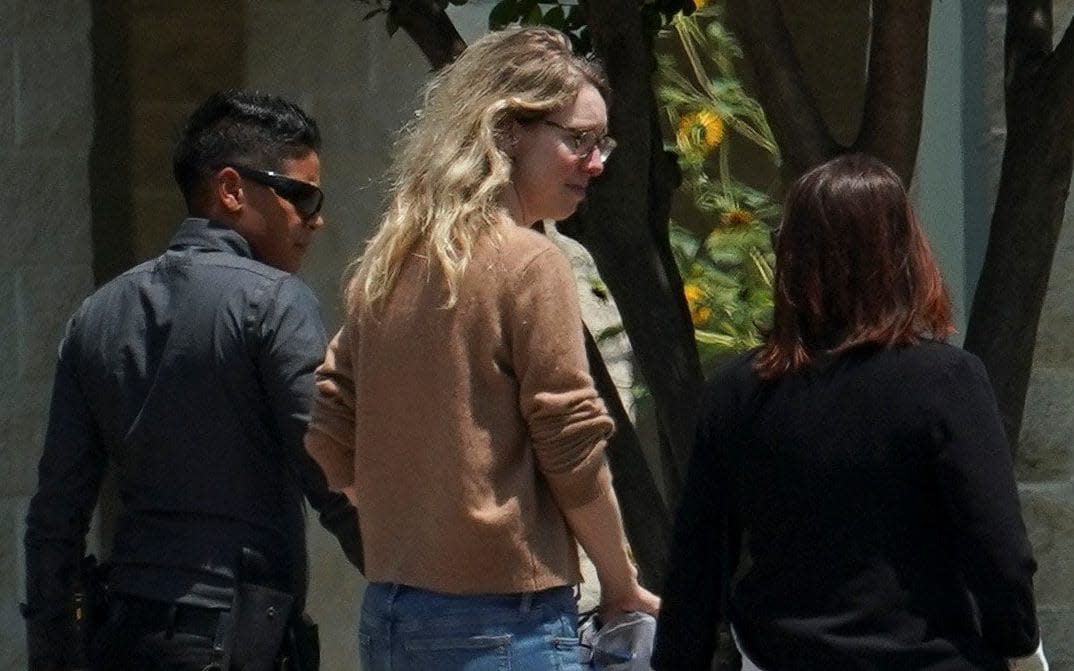 Theranos founder Elizabeth Holmes arrives to begin serving her prison sentence for defrauding investors in the failed blood-testing startup, at the Federal Prison Camp in Bryan, Texas, U.S. May 30, 2023. REUTERS/Go Nakamura - REUTERS/Go Nakamura