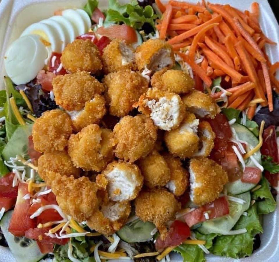 The Crispy Chicken from The Salad Spot 2. This salad includes cheddar cheese, cucumbers, tomatoes, eggs and chopped crispy chicken on a bed of iceberg lettuce. $11.99 for a regular. $13.99 for a large.