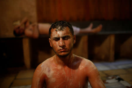 A Palestinian man relaxes after having his body lathered with soap at As-Samra bath house in Gaza City July 11, 2016. REUTERS/Suhaib Salem