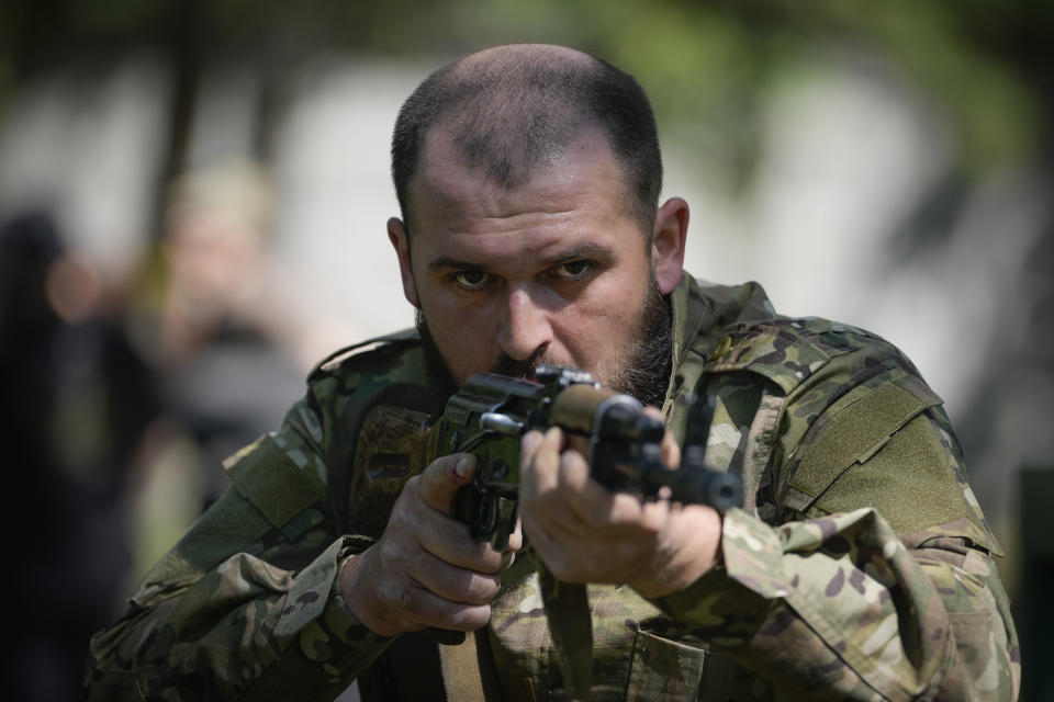 Newly recruited soldiers of the 3rd assault brigade train in Kyiv, Ukraine, Friday, May 17, 2024. A divisive mobilisation law in Ukraine came into force on Saturday, as Kyiv struggles to boost troop numbers after Russia launched a new offensive. (AP Photo/Efrem Lukatsky)