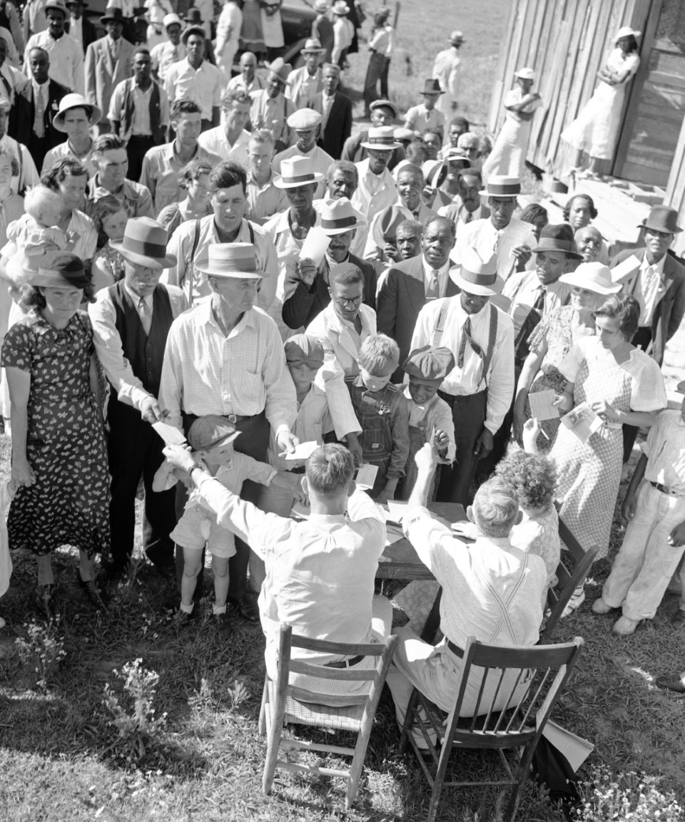 White and African American sharecroppers, tenant farmers and day wage workers join the Southern Tenant Farmer’s Union at a June 13, 1937, meeting near Earle, Arkansas.