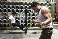 <p>Two men doing exercise in a park in the center of Mexico City. The “Gimnasios Urbanos” were built in 2016, with the goal of stimulating sports and physical exercise in the overweight population of Mexico City. (Photograph by Silvia Landi) </p>