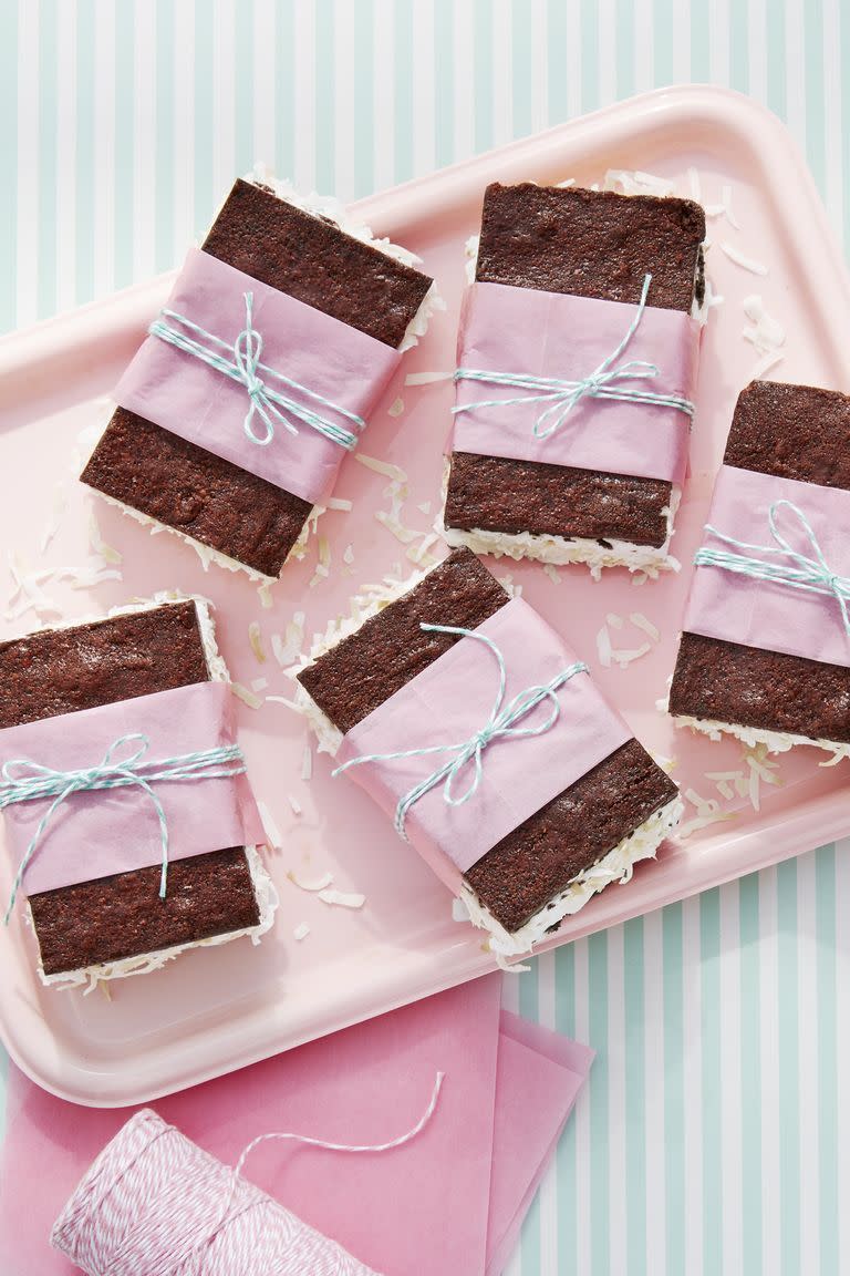 chewy brownie ice cream sandwiches arranged on a light pink serving tray