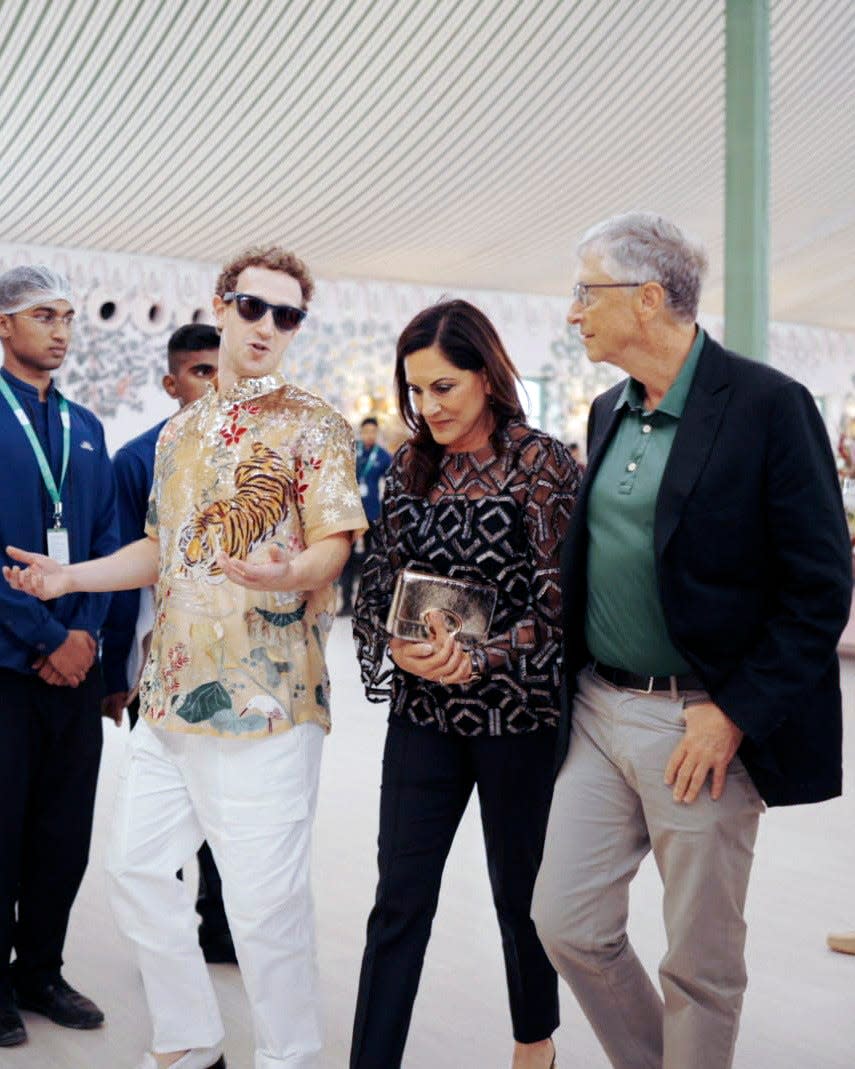 This photograph released by the Reliance group shows Mark Zuckerberg gesturing as he talks to Bill Gates, right, walking with Paula Hurd, center, at a wedding bash of billionaire industrialist Mukesh Ambani's son Anant Ambani in Jamnagar, India, Saturday, Mar. 02, 2024.