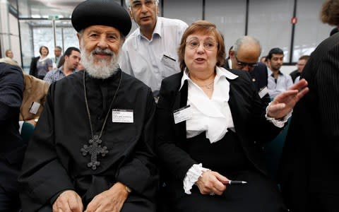 Nadia Eweida sits besides Bishop Canepa, as she waits for the beginning of the hearing on her case, at the European Human Rights Court in Strasbourg back in 2012 - Credit: Vincent Kessler/PA