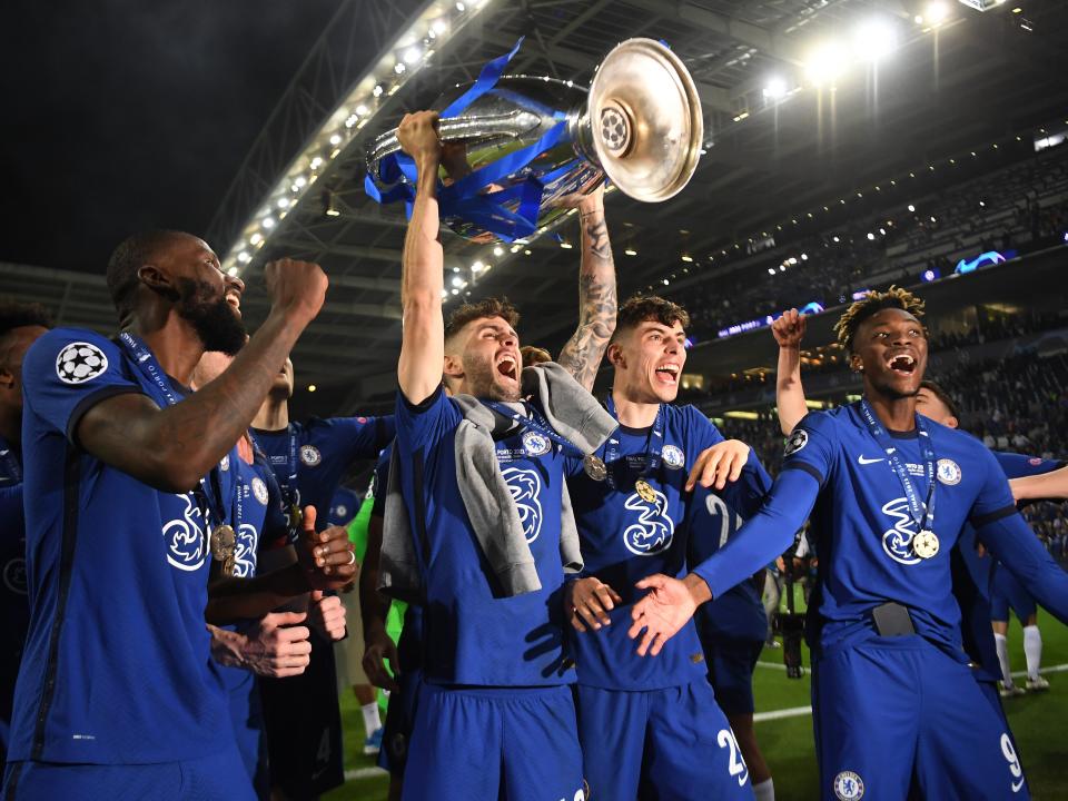 Christian Pulisic of Chelsea celebrates with the Champions League Trophy alongside teammates Antonio Ruediger, Kai Havertz and Tammy Abraham following their team's victory during the UEFA Champions League Final between Manchester City and Chelsea FC at Estadio do Dragao on May 29, 2021 in Porto, Portugal.