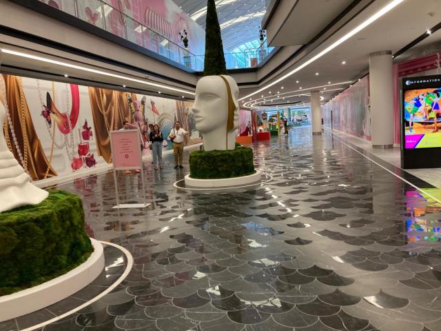 People shop in the Gucci department at a Saks Fifth Avenue store during the  opening day of the luxury wing of the American Dream shopping mall in East  Rutherford, New Jersey, on