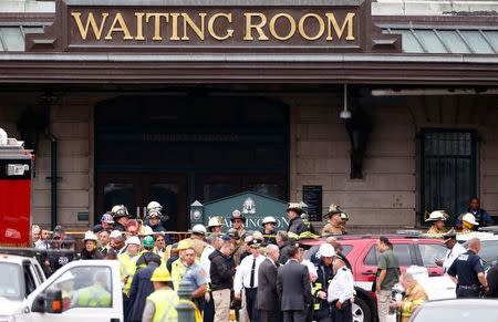 Rescue crews and police gather at the waiting room of the Hoboken train station, where a New Jersey Transit train derailed and crashed through the station, injuring more than 100 people, in Hoboken, New Jersey, U.S. September 29, 2016. REUTERS/Shannon Stapleton