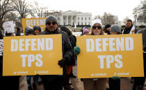 <p>Demonstrators hold signs protesting the termination of Salvadorans’ Temporary Protected Status (TPS) in front of the White House in Washington, Jan. 8, 2018. (Photo: Kevin Lamarque/Reuters) </p>