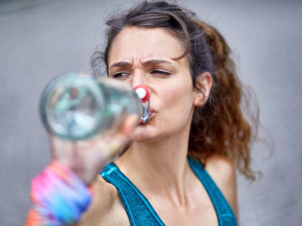 Stock photo of a woman drinking water.