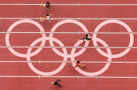 <p>Comoros's Amed Elna, St Kitts and Nevis's Amya Clarke, Congo's Natacha Ngoye Akamabi, Sierra Leone's Maggie Barrie and Mali's Djenebou Dante compete in the women's 100m heats during the Tokyo 2020 Olympic Games at the Olympic Stadium in Tokyo on July 30, 2021. (Photo by Antonin THUILLIER / AFP)</p> 