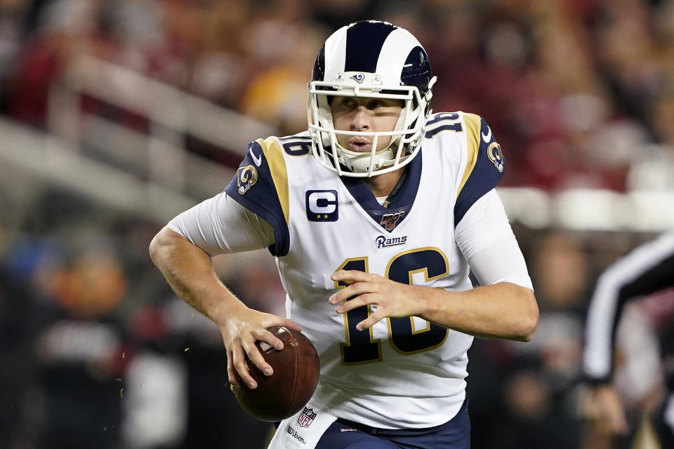 Los Angeles Rams quarterback Jared Goff rolls out to pass against the San Francisco 49ers during the first half of an NFL football game in Santa Clara, Calif., Saturday, Dec. 21, 2019. (AP Photo/Tony Avelar)