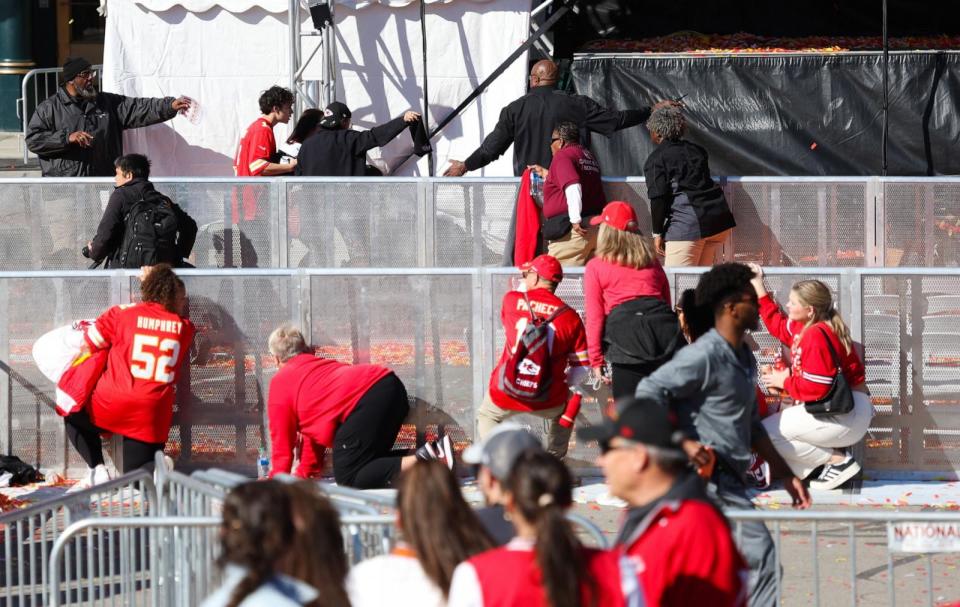 PHOTO: People take cover during a shooting at Union Station during the Kansas City Chiefs Super Bowl LVIII victory parade on February 14, 2024, in Kansas City, Missouri.  (Jamie Squire/Getty Images)