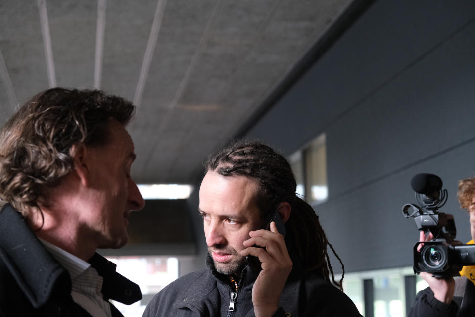 The leader of the coronavirus-skeptical group Viruswaarheid, or Virustruth, Willem Engel, and the group’s legal advisor, Jeroen Pols, left, enter the court building for an appeal hearing into the Dutch government’s curfew in The Hague, Netherlands, Friday, Feb. 19, 2021. The government is appealing a ban on the curfew imposed earlier this week by a judge in The Hague. (AP Photo/Mike Corder)