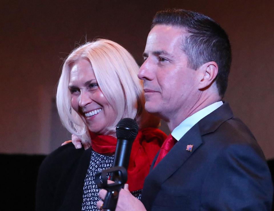 U.S. Senate candidate Bernie Moreno and his wife, Bridget, greet supporters as they take the stage at his watch party in Westlake on Tuesday.