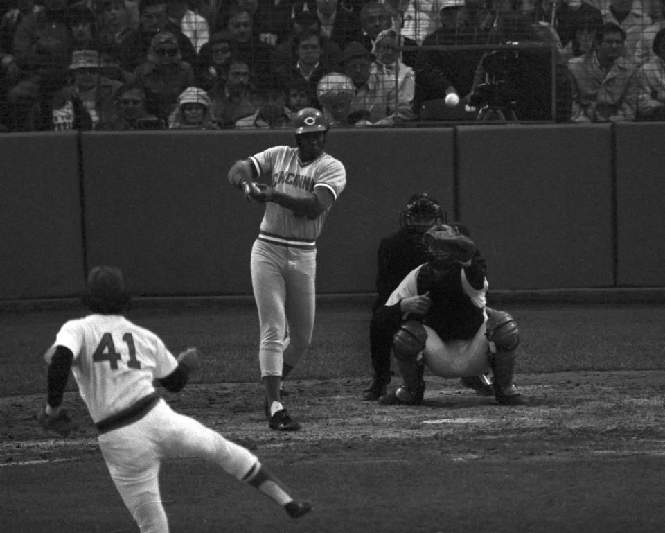 Ken Griffey drives a Dick Drago pitch into left-center for a double to score Dave Concepcion from second in the ninth inning of second World Series game at Fenway Park on Oct. 12, 1975. The Sox catcher is Carlton Fisk and the umpire is Nick Colosi. The hit gave the Reds a 3-2 win.