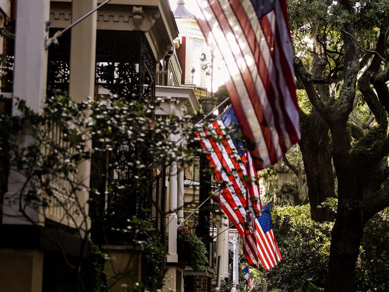 People walk around the Historic District in Savannah, Georgia, amid the novel coronavirus pandemic on 25 April 2020: (2020 Getty Images)