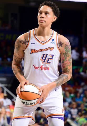 <p>Michael Gonzales/NBAE via Getty Images</p> Brittney Griner #42 of the Phoenix Mercury shoots a free throw