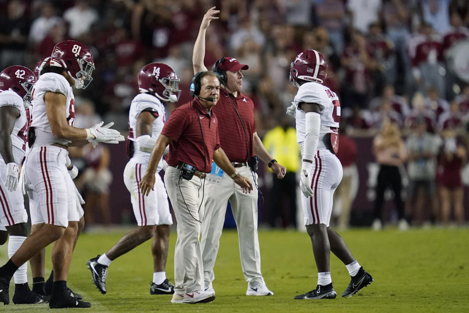 Alabama coach Nick Saban calls to players during a timeout in the first half of an NCAA college football game against Texas A&M on Saturday, Oct. 9, 2021, in College Station, Texas. (AP Photo/Sam Craft)