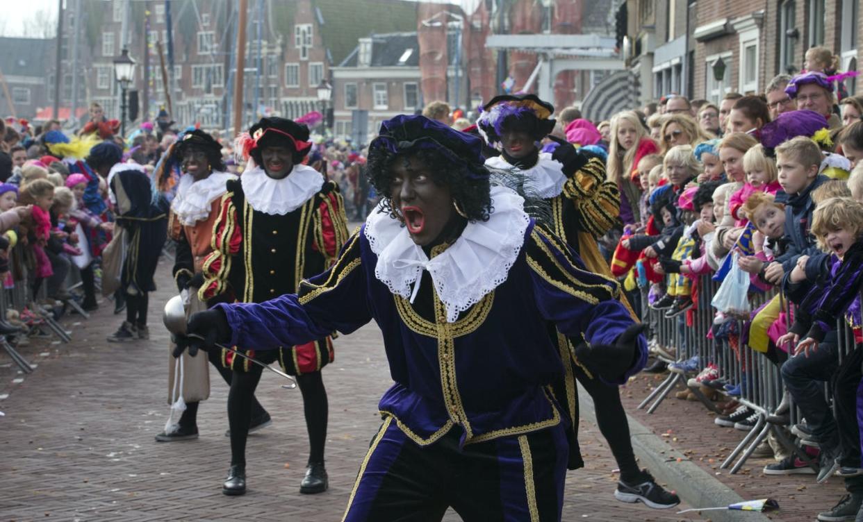 <span class="caption">An annual tradition or a national embarrassment.</span> <span class="attribution"><a class="link " href="https://newsroom.ap.org/detail/NetherlandsBlackPete/5af4c4ae2bb24eebba4c6cb938fec981/photo?Query=soot%20AND%20pete&mediaType=photo&sortBy=arrivaldatetime:desc&dateRange=Anytime&totalCount=45&currentItemNo=42" rel="nofollow noopener" target="_blank" data-ylk="slk:AP Photo/Peter Dejong;elm:context_link;itc:0;sec:content-canvas">AP Photo/Peter Dejong</a></span>