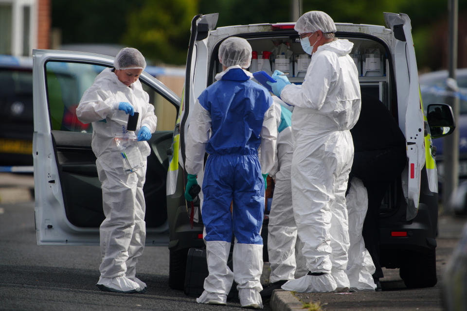 Forensic officers near to the scene in Kingsheath Avenue, Knotty Ash, Liverpool, where a nine-year-old girl has been fatally shot. Officers from Merseyside Police have started a murder investigation after attending a house at 10pm Monday following reports that an unknown male had fired a gun inside the property. Picture date: Tuesday August 23, 2022.