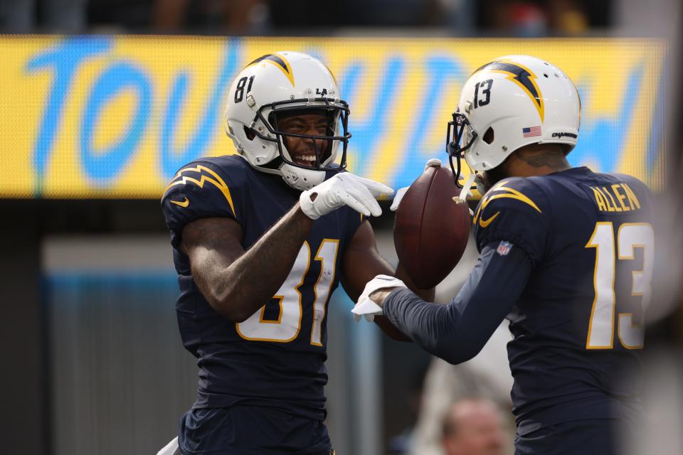 The Chargers' Mike Williams, left, and Keenan Allen are licking their chops thinking about going up against a Titans defense that gives up the most fantasy points to wide receivers.