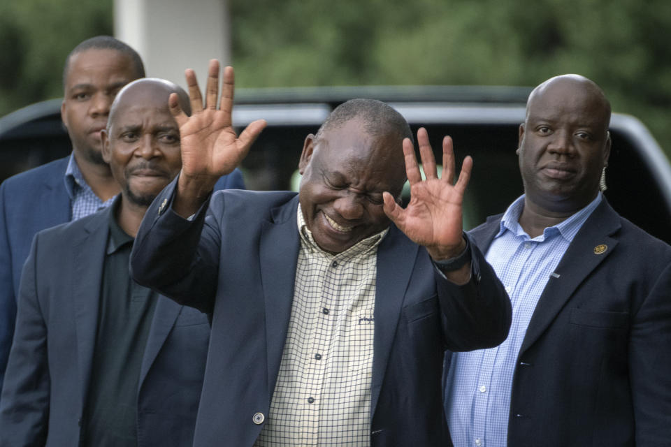 South African President Cyril Ramaphosa leaves an African National Congress (ANC) national executive committee meeting in Johannesburg, South Africa, Monday Dec. 5, 2022. Ramaphosa might lose his job, and his reputation as a corruption fighter, as he faces possible impeachment over claims that he tried to cover up the theft of millions of dollars stashed inside a couch on his farm. (AP Photo/Jerome Delay)