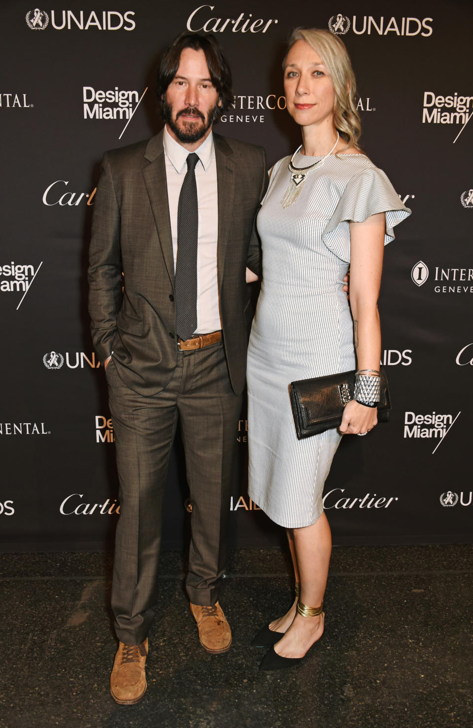 A photo of Alexandra Grant and Keanu Reeves on the red carpet at the UNAIDS Gala during Art Basel 2016 at Messe Basel on June 13, 2016 in Basel, Switzerland.