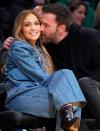 <p>Jennifer Lopez and Ben Affleck are loved-up on Dec. 7 while watching the Los Angeles Lakers take on the Boston Celtics at the Staples Center in L.A. </p>