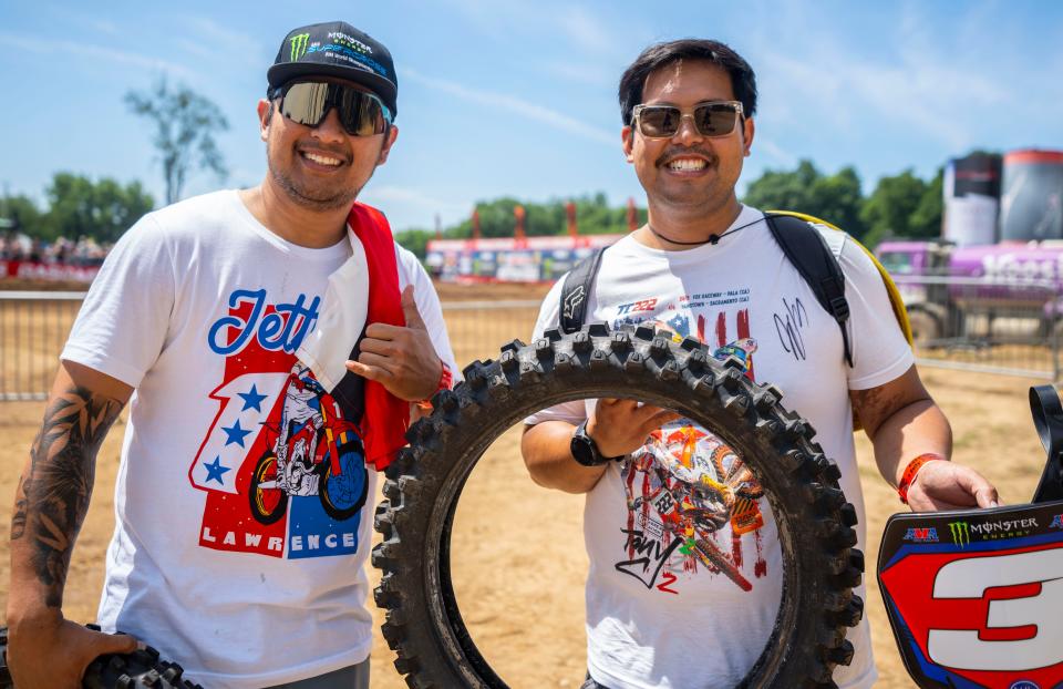 Ian Relente and Imman Icao with some free merch during the KTM RedBud National Lucas Oil Pro Motocross Championship Saturday, July 2, 2022 at the RedBud MX track in Buchanan, Mich.