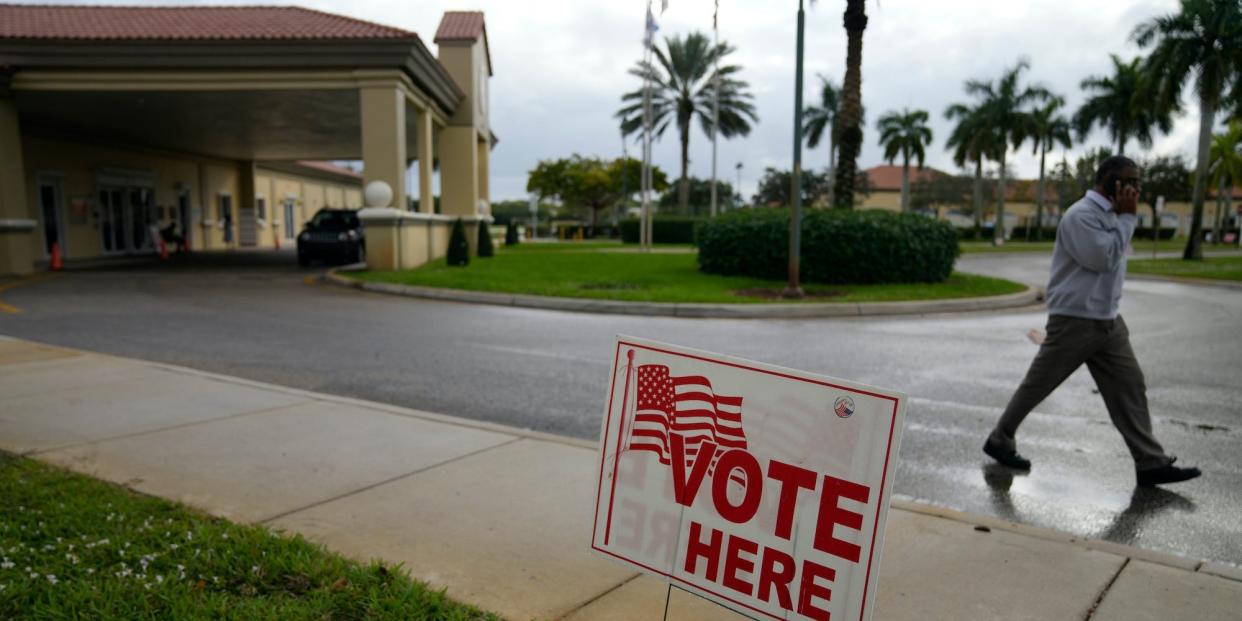 A man leaves a polling place at the Sunset Lakes Community Center as voting takes place in a special election for Florida's 20th Congressional District seat, Tuesday, Jan. 11, 2022, in Miramar, Fla.