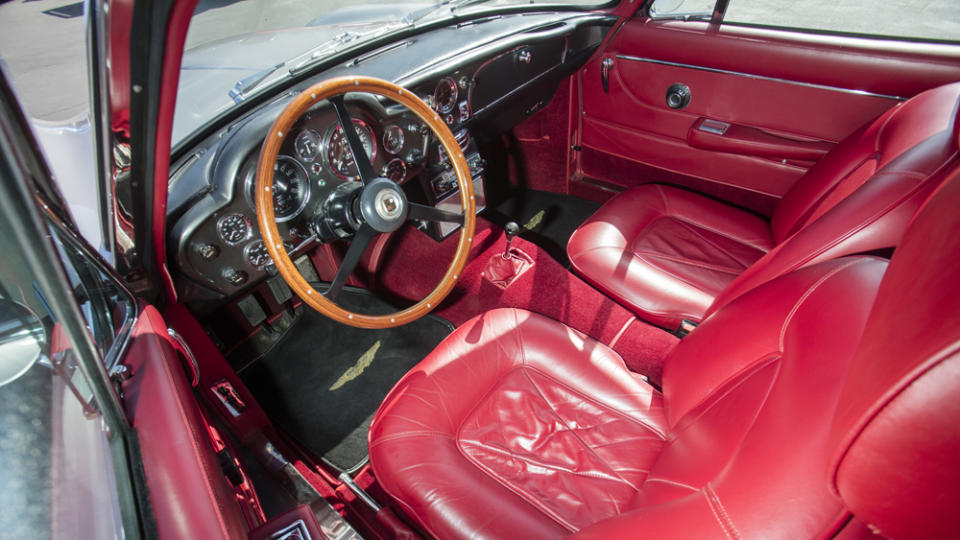 The interior’s charms include red Connolly leather seats and a tidy dash sprawling with Smiths gauges. - Credit: Bonhams