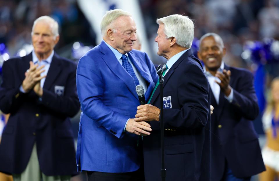 Dec 30, 2023; Arlington, Texas, USA; Dallas Cowboys former head coach Jimmy Johnson hugs owner Jerry Jones after being inducted into the ring of honor at halftime of the game against the Detroit Lions at AT&T Stadium. Mandatory Credit: Kevin Jairaj-USA TODAY Sports