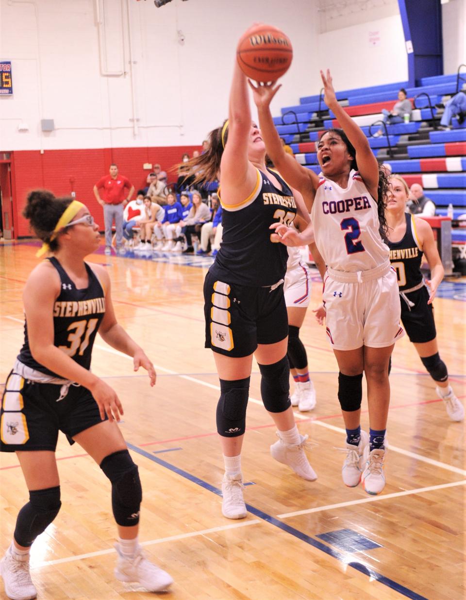 Cooper's Alliyah Ralston (2) shoots as Stephenville's Zoe Birdwell defends in the first quarter.
