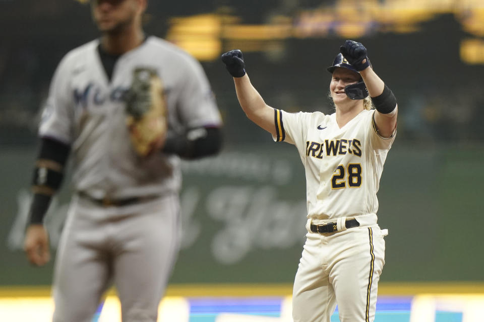 Milwaukee Brewers' Joey Wiemer (28) gestures after hitting an RBI-double during the eighth inning of a baseball game against the Miami Marlins, Monday, Sept. 11, 2023, in Milwaukee. (AP Photo/Aaron Gash)