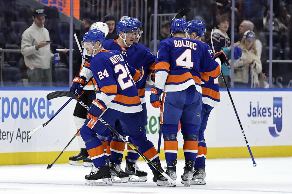 New York Islanders defenseman Scott Mayfield (24) skates away after celebrating a goal scored by Anders Lee in the first period of an NHL hockey game against the Philadelphia Flyers on Saturday, April 8, 2023, in Elmont, N.Y. (AP Photo/Adam Hunger)