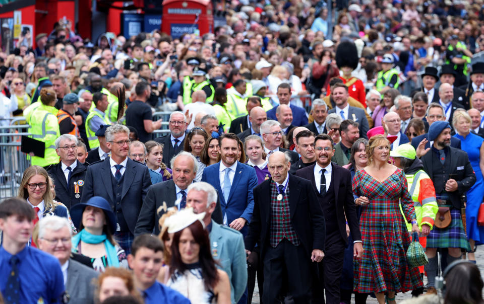 EDINBURGH, SCOTLAND - JULY 05: Invited guests take part in the procession ahead of a national service of thanksgiving and dedication to the coronation of King Charles III and Queen Camilla at St Giles' Cathedral on July 05, 2023 in Edinburgh, Scotland. During the service of thanksgiving and dedication for the Coronation of King Charles III and Queen Camilla, the Honours of Scotland (the Scottish crown jewels) are presented to the new King. The service is based on a similar service held at St Giles' 70 years ago to mark the coronation of Queen Elizabeth II but unlike the 1953 service, the Stone of Destiny, on which ancient Scottish kings were crowned, will be present in the cathedral. (Photo by Chris Jackson - WPA Pool/Getty Images)