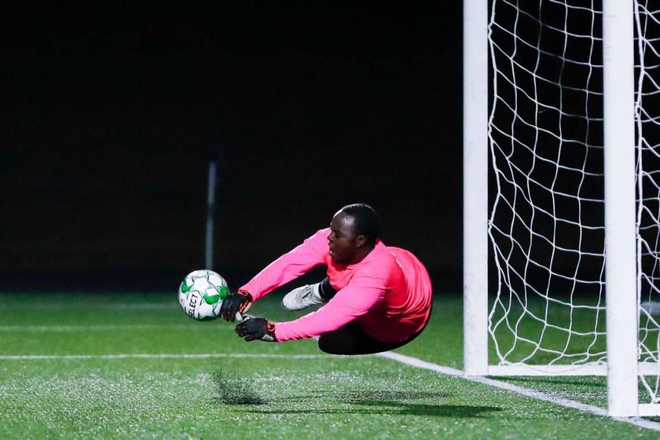 Frederick Douglass goalkeeper Delfin Iteriteka saves a penalty kick to help preserve the Broncos’ victory over two-time defending state champion Dunbar on Thursday night.