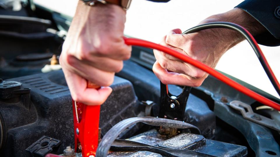 a person working on a car engine