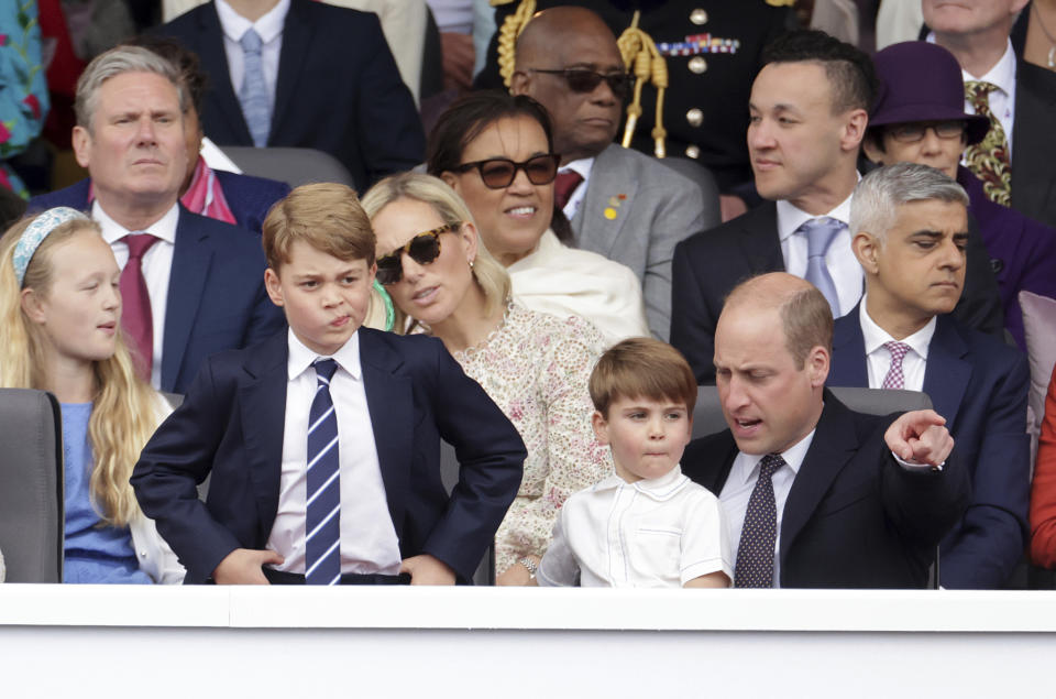 Prince George, Prince Louis and Prince William watch the Platinum Jubilee Pageant outside Buckingham Palace in London, Sunday June 5, 2022, on the last of four days of celebrations to mark the Platinum Jubilee. The pageant will be a carnival procession up The Mall featuring giant puppets and celebrities that will depict key moments from Queen Elizabeth II’s seven decades on the throne. (Chris Jackson/Pool Photo via AP)