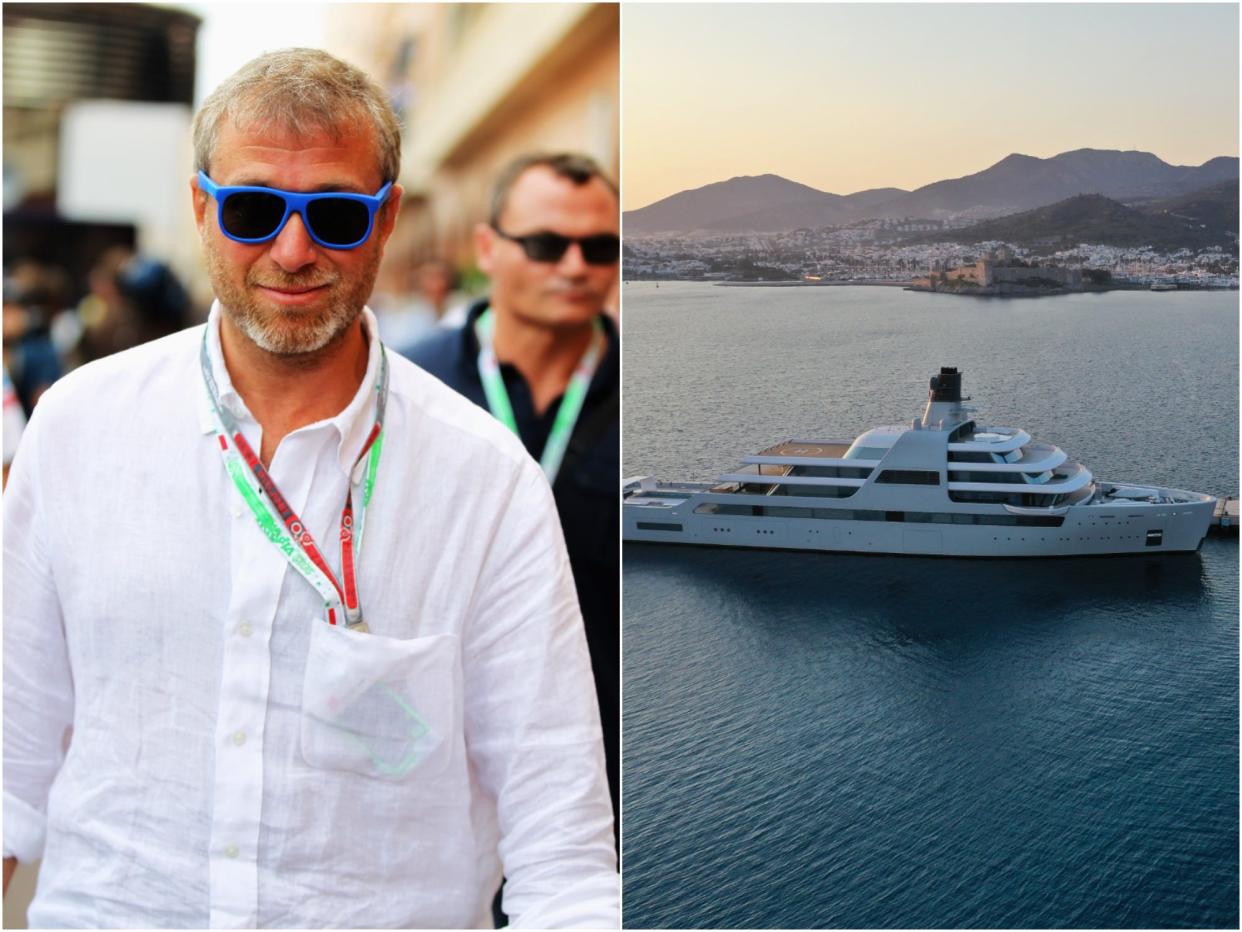 Chelsea Football Club owner and businessman Roman Abramovich next to a picture of his yacht, Solaris.