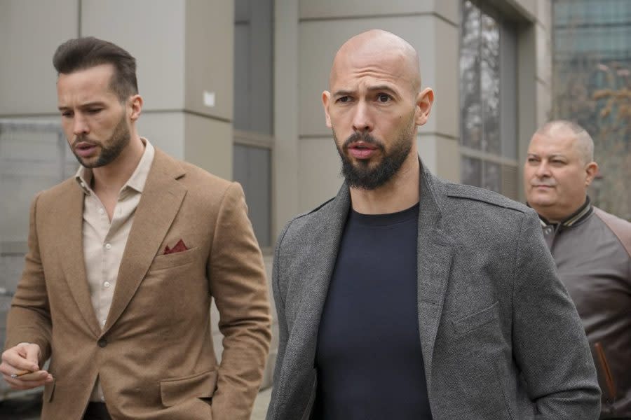 Andrew Tate, right, and his brother Tristan leave a tribunal in Bucharest, Romania, Thursday, Feb. 29, 2024. Online influencer Andrew Tate was detained in Romania and handed an arrest warrant issued by British authorities, his spokesperson said Tuesday, March 12. Tate, 37, and his brother Tristan Tate were detained Monday evening on allegations of sexual aggression in a U.K. case dating back to 2012-2015, spokesperson Mateea Petrescu said. (AP Photo/Vadim Ghirda, File)