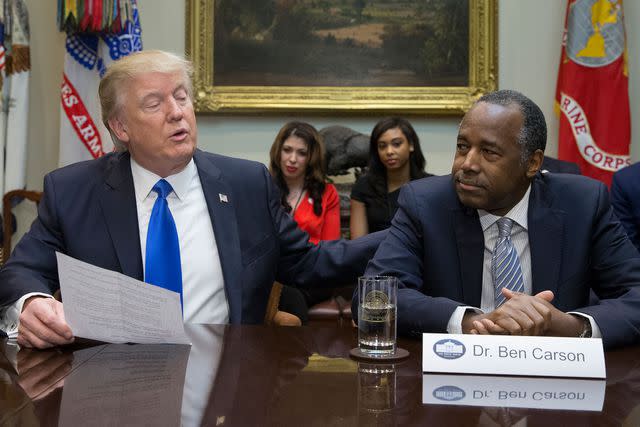 Michael Reynolds - Pool/Getty Images Then-President Donald Trump with Ben Carson, his secretary of housing and urban development