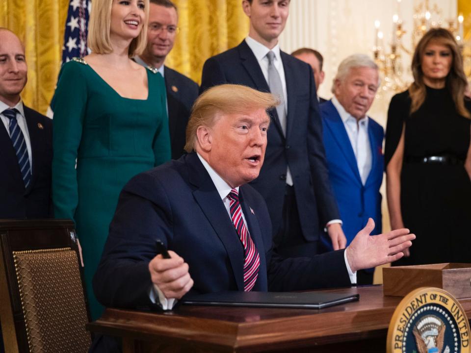 Donald Trump gesture signing east room