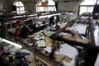 People work at a mink fur clothing factory in Shangcun